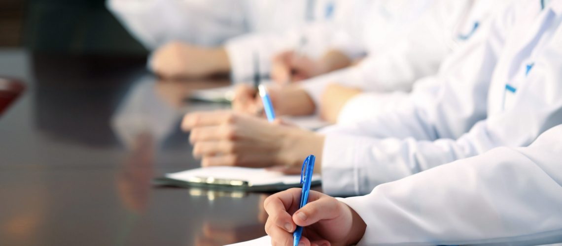 Medical workers working in conference room